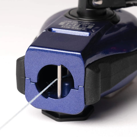 Close-up of the Professional Grade Hella Durable Mini Chalk Line Tool featuring heavy duty aluminum housing and retracting mechanism.
