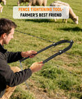 Person using Beefy Heavy Duty Fence Fixer Wire Repair Tool With Lifetime Replacement Guarantee For Electric Fences Horse Fencing And Mesh Wire Projects Corrosion Proof Iron Construction In Durable Black Finish on farm fence.