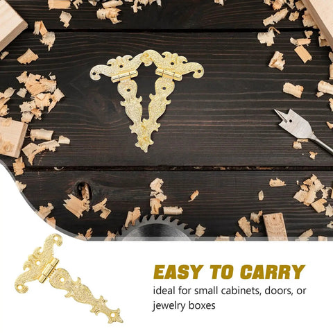 Set Of 2 Vintage Zinc Alloy Door Hinges Beefy Heavy Duty Decorative Box Hinges With Stable Support And Reliable Connection For Home Decor And Flower Boxes In Gold, displayed on a wooden tabletop with wood shavings and tools.