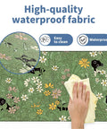 XL Plant Themed Mouse Pad 31.5 X 11.8 Inches, close-up of waterproof fabric with cute plant design being cleaned with cloth.