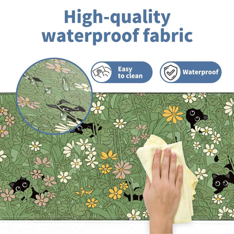 XL Plant Themed Mouse Pad 31.5 X 11.8 Inches, close-up of waterproof fabric with cute plant design being cleaned with cloth.