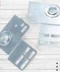 3 3/8 Inch Bearing End Plates Brackets For 2 Inch Track Wood Or Steel Garage Doors Residential End Bearing Brackets Beefy Steel One Pair Bearing Bracket Parts visible on wooden surface