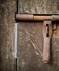 Rustic wooden door featuring a thickened 4 inch stainless steel furniture hinge with bearing workhorse heavy duty cabinet door butt hinge.
