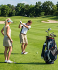 Golfers on a green with a golf bag, emphasizing the Two Pack Golf Ball Storage Bags Nylon Mesh Pouches With Drawstring Organizer.