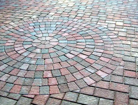 Heavy Duty Water Based Paver And Concrete Sealer Shields Brick Stone Masonry Locks Joint Sand Boosts Raw Color UV Shield Waterproof Patio Armor Slick Crisp Finish Five Gallon applied to a circular brick pattern.