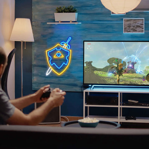Sword and Shield LED Gaming Light for Game Room Decor, Zelda Inspired Sword and Shield Sign next to gaming setup