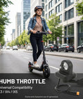 Person riding an electric scooter with a thumb throttle accelerator, shown with a right-hand replacement for 22mm handlebars.