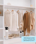 3-In-1 No Iron Wrinkle Release, Static Cling Remover, Odor Eliminator And Fabric Refresher Spray bottles on shelf in closet