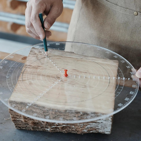 Person using Clear Acrylic Center Finder Gauge For Circles 11.8 Inch Diameter Lathe Centering Tool on wood block.