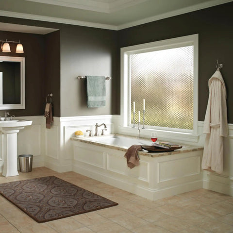 Cassidy 24 Inch Wall Mount Towel Bar With Brilliance Stainless Finish in modern bathroom, wall-mounted near bathtub.