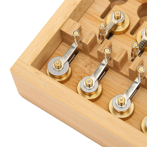 Close-up of copper tools in Watch Winder Repair Tools Kit For Watchmakers 20 Model Set In Sturdy Wooden Box