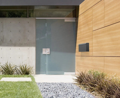 Edward Wall Mounted Mailbox In Slick Matte Black With Powder Coated Steel And Medium Capacity on modern house facade