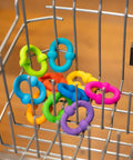 Plip Links Silicone Building Toys For Open Ended Creative Play A Fun Construction Set For Kids Aged 3 To 12 That Sparks STEM Skills Through Pattern Building And Preschooler Hands On Imagination, colorful silicone links in a metal basket