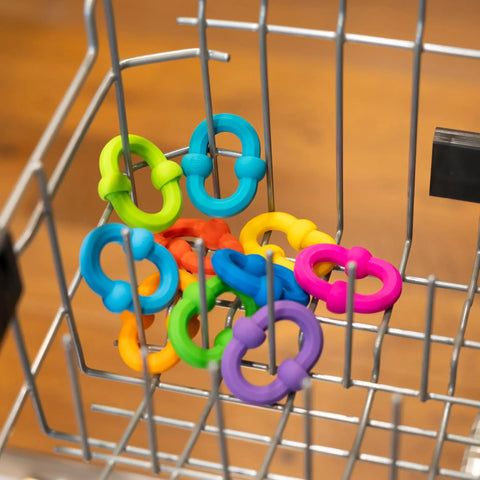 Plip Links Silicone Building Toys For Open Ended Creative Play A Fun Construction Set For Kids Aged 3 To 12 That Sparks STEM Skills Through Pattern Building And Preschooler Hands On Imagination, colorful silicone links in a metal basket