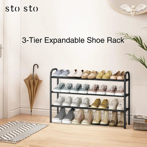 Expandable Three Tier Metal Shoe Rack Holds Up To Sixteen Pairs with shoes displayed in a hallway next to an umbrella.