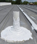 Pipe on roof sealed with Heavy Duty Hundred Percent Silicone Patch Coating For Waterproofing Those Tough To Reach Spots On Roofs Gutters And Walls Easy Application With Brush Or Putty Knife One Gallon Translucent.