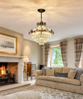 Living room with Black Crystal Chandelier With Seven Light Pendant Ceiling Fixture Dimmable E14 compatible above a cozy fireplace.