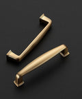 Close-up of Champagne Bronze Cabinet Pulls 3-3/4 Inch Center To Center Drawer Handles, zinc alloy, elegant design on black background.