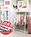 Clothing store interior with visible 'Sorry No Public Restrooms' sign; Two Pack No Public Restroom Signs For Biz And Home Self Adhesive Weatherproof Vinyl Stickers