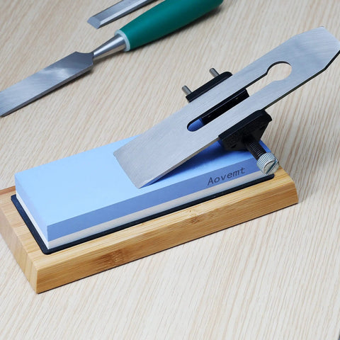 Honing Guide For Chisels And Planes With Precise Angle Control And Sharp Edge Every Time on wooden table with sharpening stone.