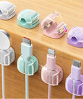 8 Pack Cable Clips Cord Organizer With One Hand Lock And Extra Strong Adhesive, installed on desk managing various device cables