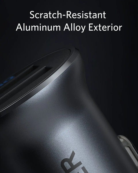 Close-up of ultra compact aluminum alloy dual USB car charger with scratch-resistant exterior and blue LED for iPhone and iPad.
