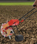 Hand Push Garden Seeder With 7 Nozzles Adjustable Depth 1.38 To 3.07 Inches 9.06 Inch Row Spacing in use on soil