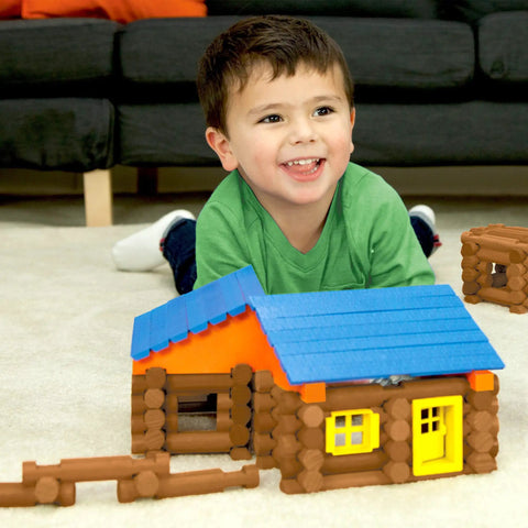 Child playing with Oak Creek Lodge Wooden Building Set With 137 Real Maple Logs, Retro Construction Fun For Kids 3 Plus