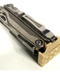 Brass Hammer Head Mod For Multitool With Dual Locking System attached to tool, hand finished in USA, CNC made.