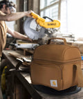 Rugged Insulated Lunch Box For Men, Soft Shell Cooler Bag Built For Camping, Worksites And Construction, in brown on workbench