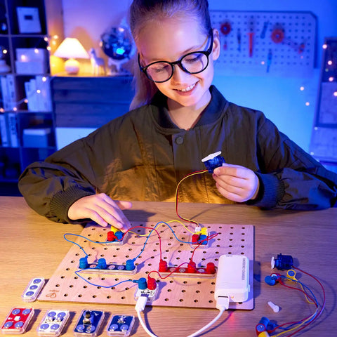 Circuit Explorer Boost Kit for Kids 8 and Up DIY Electronics Lab With 40 Piece Set Motor And LED Lights Cool Hands On STEAM Experiments For Curious Builders, girl building circuit