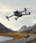 Air 3 Fly More Combo With RC 2 Controller, 4K Drone soaring over a scenic mountain landscape, capturing aerial footage at 20Km range.