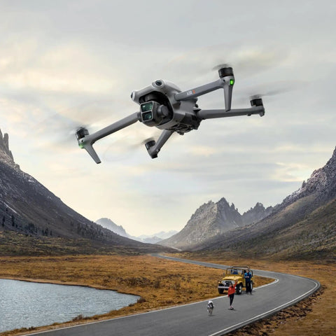 Air 3 Fly More Combo With RC 2 Controller, 4K Drone soaring over a scenic mountain landscape, capturing aerial footage at 20Km range.