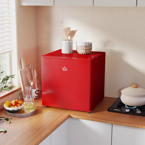 Score This Snazzy Countertop Mini Freezer For Easy Setup And Keep Your Daily Grub Ice Cold Using 1.1 Cubic Feet Of Removable Shelf Storage Built For Dorms Or Rv Life on kitchen counter with utensils.