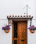 433MHz 3dBi Omni Antenna with 9.8 ft RG58 Coax Cable mounted above wooden door with flowers