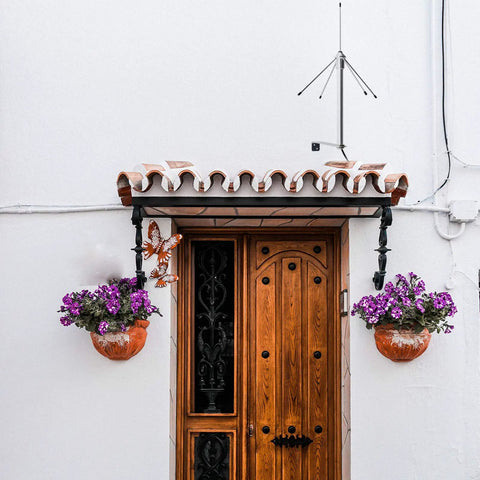 433MHz 3dBi Omni Antenna with 9.8 ft RG58 Coax Cable mounted above wooden door with flowers