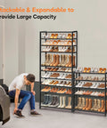Heavy Duty 5 Tier Metal Shoe Rack Organizer For Garage And Entryway, stackable, holding boots and shoes next to a person tying shoes