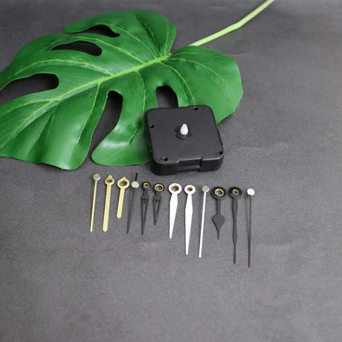 Hassle Free Snap In Dial Quartz Clock Movement Kit With Sleek Straight Hands includes a black movement and various clock hands.