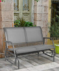 Two Person Swing Glider Chair 48 Inch Spacious Outdoor Lounge Bench For Patio Backyard Poolside Lawn Indoor Use Durable Steel Frame Weatherproof Fabric Cozy And Chill against rustic backdrop
