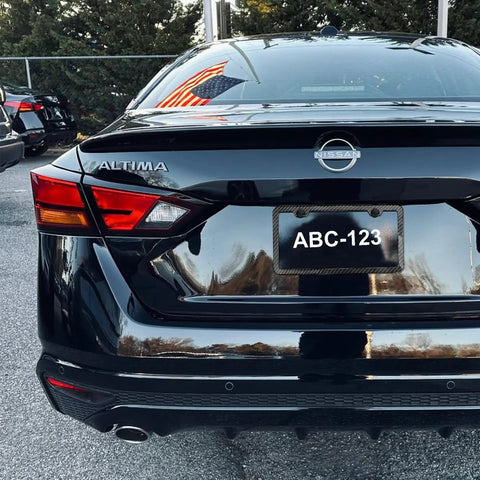 Car rear view with Carbon Fiber Look License Plate Frame Made From Durable Aluminum Scratch Resistant Metal Plate Holder