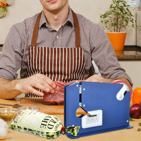 Man using tape sealer with 300 Count Ground Pork Freezer Bags 1Lb Ground Meat Bags for packaging meat on a kitchen table.