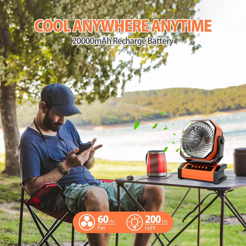 20000mAh Rechargeable Camping Fan With Built In Light And Remote on picnic table near sitting man in outdoor setting
