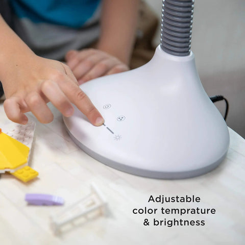 Child adjusting SmartLight Full Spectrum LED Desk Lamp With Adjustable Brightness And Flexible Gooseneck USB Charging Port Eye Strain Reduction Perfect For Reading Art Crafting Homework And Late Night Projects control panel