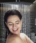 Woman enjoying shower under Black 10 Inch Rain Shower System With Wall Mounted Mixer, Luxury Spa Grade Set, Premium Pressure Balance Valve.