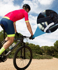 Cyclist riding with Bike Brake Lever Silicone Sleeve 2 Pack Anti Slip Cover For Mountain And Road Bikes on handlebars.