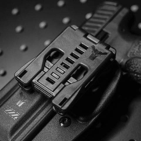 Tough As Nails USA Made Belt Clip Attachment For Concealed Carry Holsters Magazine Pouches And Tactical Knife Sheaths equipped on a holster.