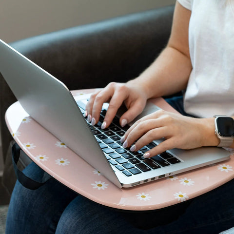 Person using laptop on MyStyle Lap Desk Pink Daisy 17 By 13.2 Inch Surface Fits 15.6 Inch Laptops Ultra Lightweight 1.15 Lb With Built In Carry Handle
