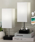 Massive 39.3 Inch Desk Lamp For Home Office with USB ports and two LED bulbs on books, white shades glowing softly