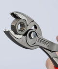 TwinGrip Pliers 10 Inch With Front And Side Gripping Jaws For Stripped Screws in use on a hex nut
