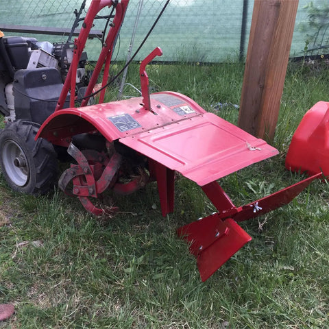 Hiller Furrower Kit for Rear Tine Tillers with Adjustable Wing and Three Connection Styles attached to a red rear tine tiller